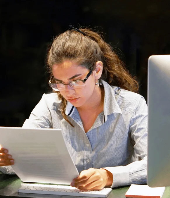 A translator formats an academic transcript with Express Translation Services, preserving grades, seals, and layout fast.