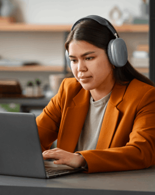 A transcriptionist is providing Telugu transcription services delivering accuracy for all needs, ensuring precision.