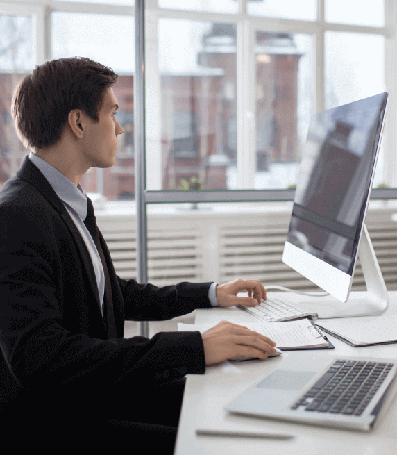 Transcriptionist working on a laptop, ensuring transcription services in Rochester industry with technical compliance. Transcriptionist working on a laptop, ensuring transcription services in Rochester industry with technical compliance.