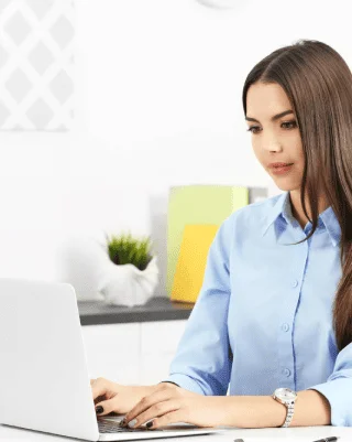 A typist working on book typing services to help authors digitize manuscripts into editable digital files securely.