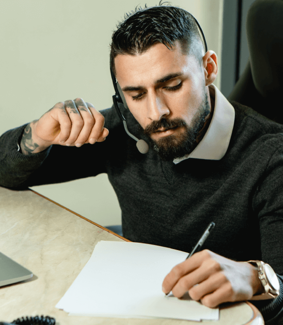 Male transcriptionist preparing a written transcript for an audio file in Rochester. Male transcriptionist preparing a written transcript for an audio file in Rochester.