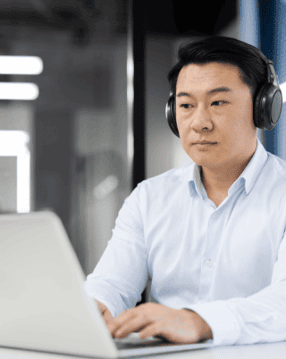 A professional transcriber working on accurate Japanese transcription services, ensuring high quality and timely delivery.