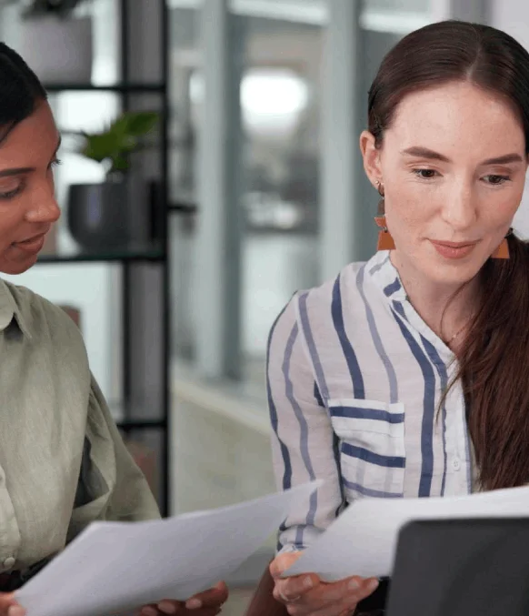 A translator uses Instant Translation Services to format a business report, keeping charts, headings, and terms consistent.