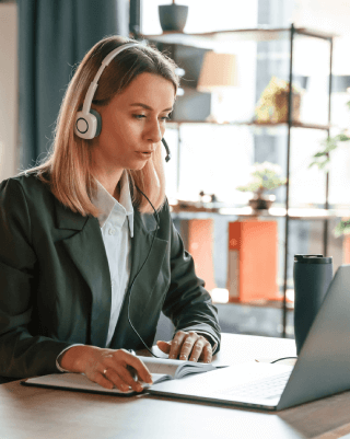 Transcriber working on accurate and professional Cincinnati transcription services for businesses in various industries.