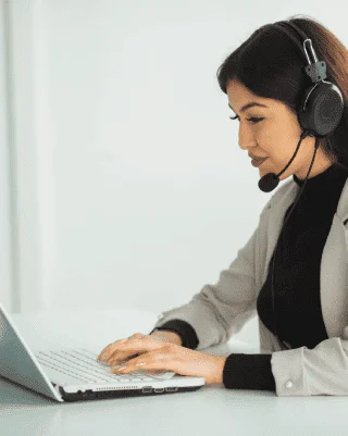 The captioner works on closed captioning services in Albuquerque, ensuring text syncs with video for better accessibility.