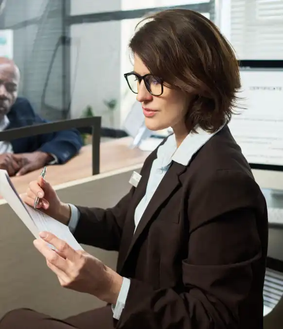 A compliance officer uses Investigative Transcription Services to review an audit interview with speaker ID and timestamps.