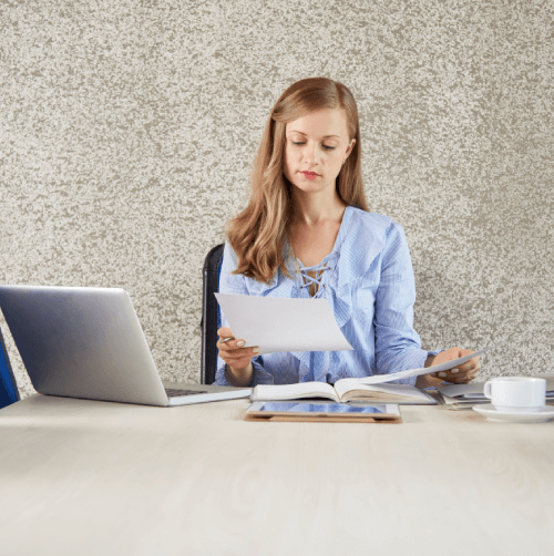 Expert translator working on laptop for translation of confidential business documents, ensuring trust and discretion. Expert translator working on laptop for translation of confidential business documents, ensuring trust and discretion.