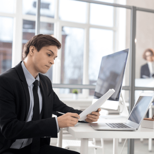 A translator working on document Translation Service Malolos, translating birth certificates and legal documents for clients.