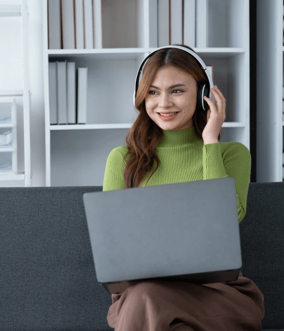 A woman working on laptop, highlighting fast and reliable Automated transcription services with quick turnarounds. A woman working on laptop, highlighting fast and reliable Automated transcription services with quick turnarounds.