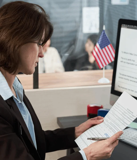 A translator formats an immigration document in Instant Translation Services, matching USCIS requirements and seals.