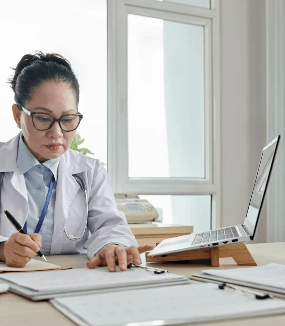 A clinician checks dosage abbreviations in a transcript made with Korean Transcription Services for industry-specific.