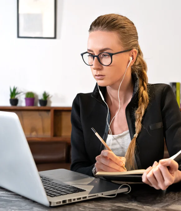 A paralegal formats a report as Investigative Transcription Services produce industry-specific transcripts for review.