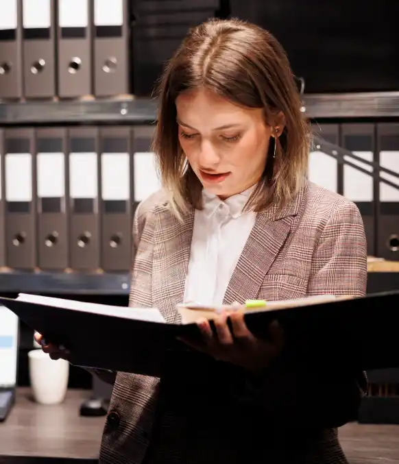 An attorney highlights a legal investigative transcript produced by Investigative Transcription Services for hearing prep.