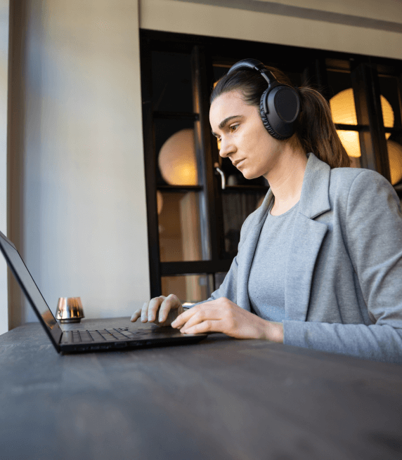 A transcriptionist following a multi step Legal Transcription Services process for accurate legal transcripts.