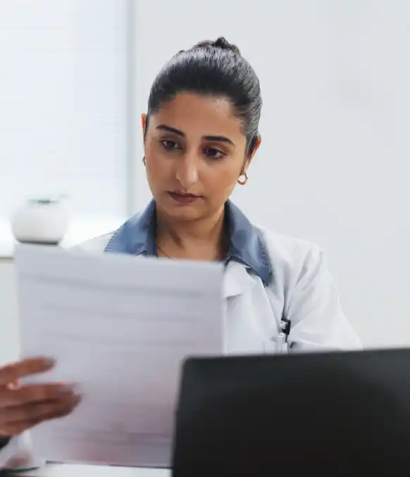 A clinic staffer uses Fast Typing Services for medical patient notes, turning handwritten charts into EHR-ready files.
