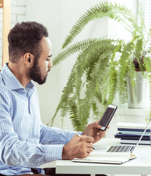 Professional working on a laptop, showcasing accurate phone call transcription services for all business and personal needs. Professional working on a laptop, showcasing accurate phone call transcription services for all business and personal needs.