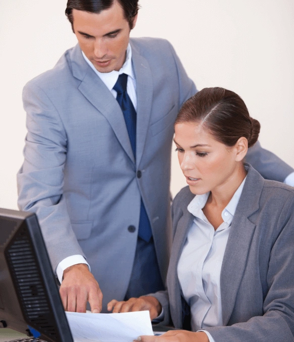 A professionals analyzing documents, showcasing expert translation services ensuring precision for global audiences. A professionals analyzing documents, showcasing expert translation services ensuring precision for global audiences.