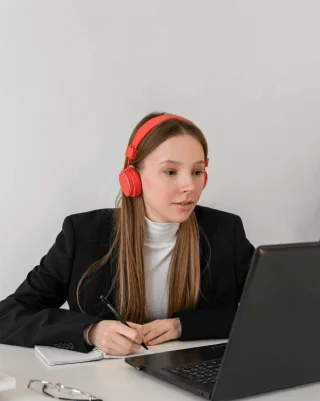 A professional transcriptionist using advanced tools for Javanese transcription services, delivering accurate transcriptions.