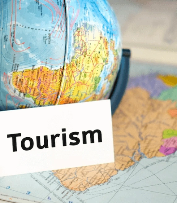 A globe on a world map with word tourism, representing tourism video translation services tailored and travel industries. A globe on a world map with word tourism, representing tourism video translation services tailored and travel industries.