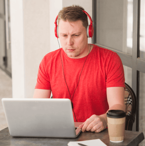 A transcriptionist reviewing rush transcription tiers, offering verbatim and clean verbatim options for clients' needs.