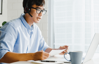Professional working on the laptop,representing fast, affordable, and customer-centric transcription services.