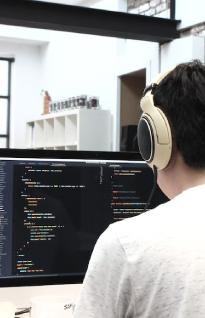 A transcriber expert using headphones to ensure security and privacy of work
