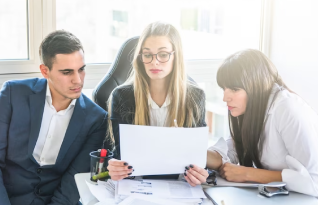 A team of professional transcribers working diligently on various documents in Seattle.