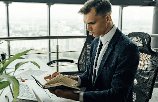 A transcriber making notes for transcription