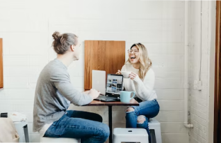 Two transcribers in office working on a project 