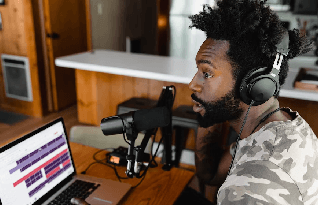  Native transcriber wearing headphones and listening to a voice