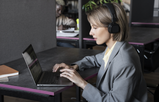 A transcriber delivering accurate results using Oxnard transcription services tailored for legal, medical, or business needs.