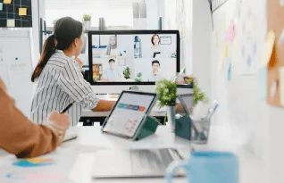 Employees attending a business meeting on a video call