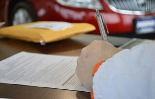 Person signing a business contract document