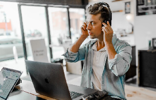  A transcriber listening to an audio on his headphones