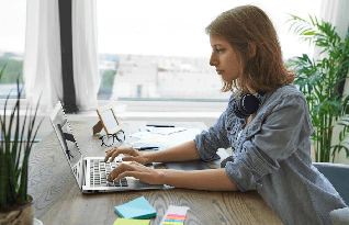 Audio Transcriber working on laptop