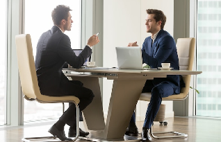 A business meeting between two employees