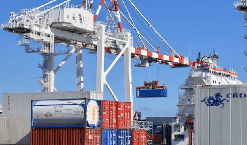 Containers being unloaded at an active Port