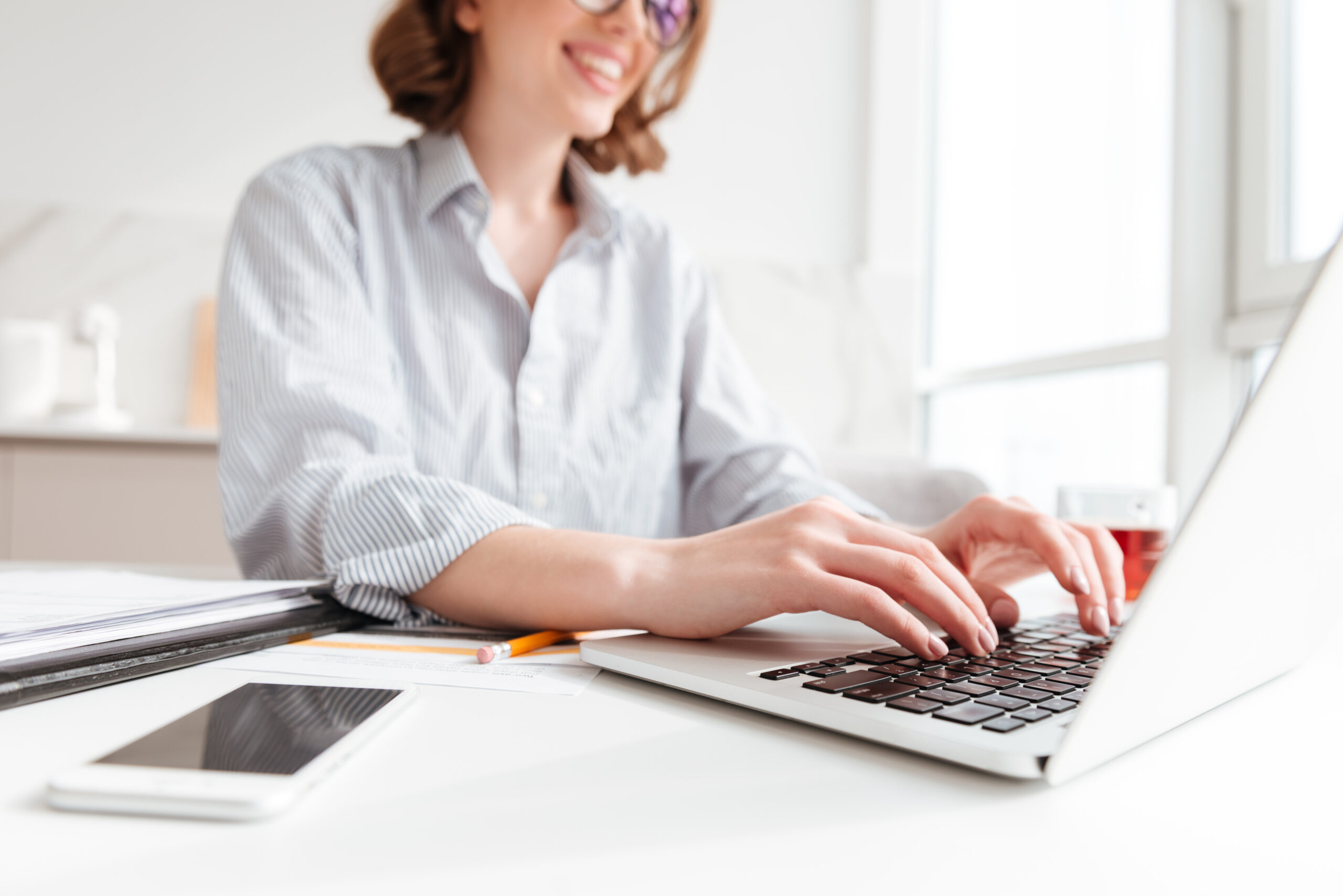 A professional typist working on typing services for worldwide business
