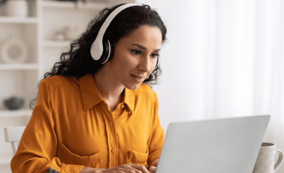 A transcriptionist working on Miami transcription services to accurately convert audio files to text.